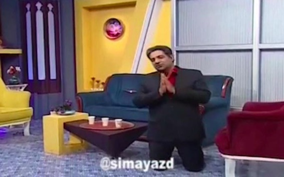 伊朗主持人直播中跪下:听我的吧 疫情期间别出门